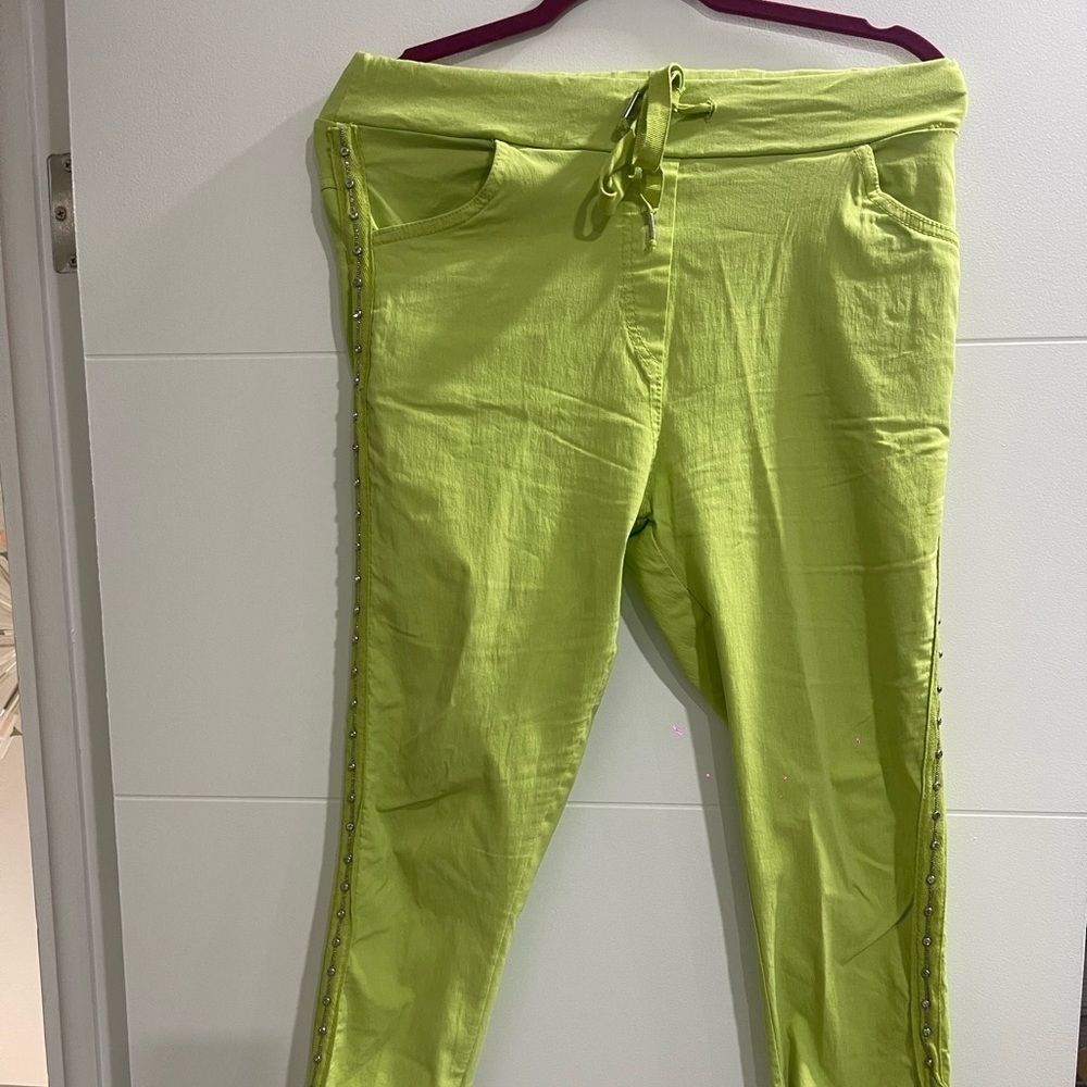 Italian pants in lime Green with ringtones in the side never used